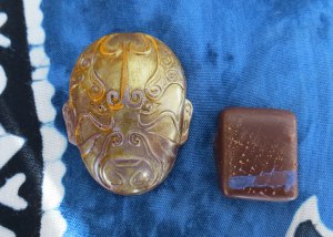 Bon bon on left: Caramelized champagne mango with Scorpion chilis blended with Danta’s magnificent La Soledad criollo 40% milk chocolate from Guatemala, finished in Tango 67% Dark chocolate. On right: Almond gianduja of Red Rack Ale and fresh blood orange juice in Axiom 60% dark chocolate.